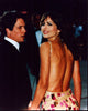 Hugh Grant and Elizabeth Hurley looking over shoulder in backless dress photo print.