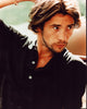 Jay Kay photo print in black top with hand raised.