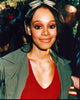 Lisa Lopes vibrant photo print in green jacket and red top