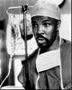 Eriq La Salle wearing scrubs in black and white photo print.