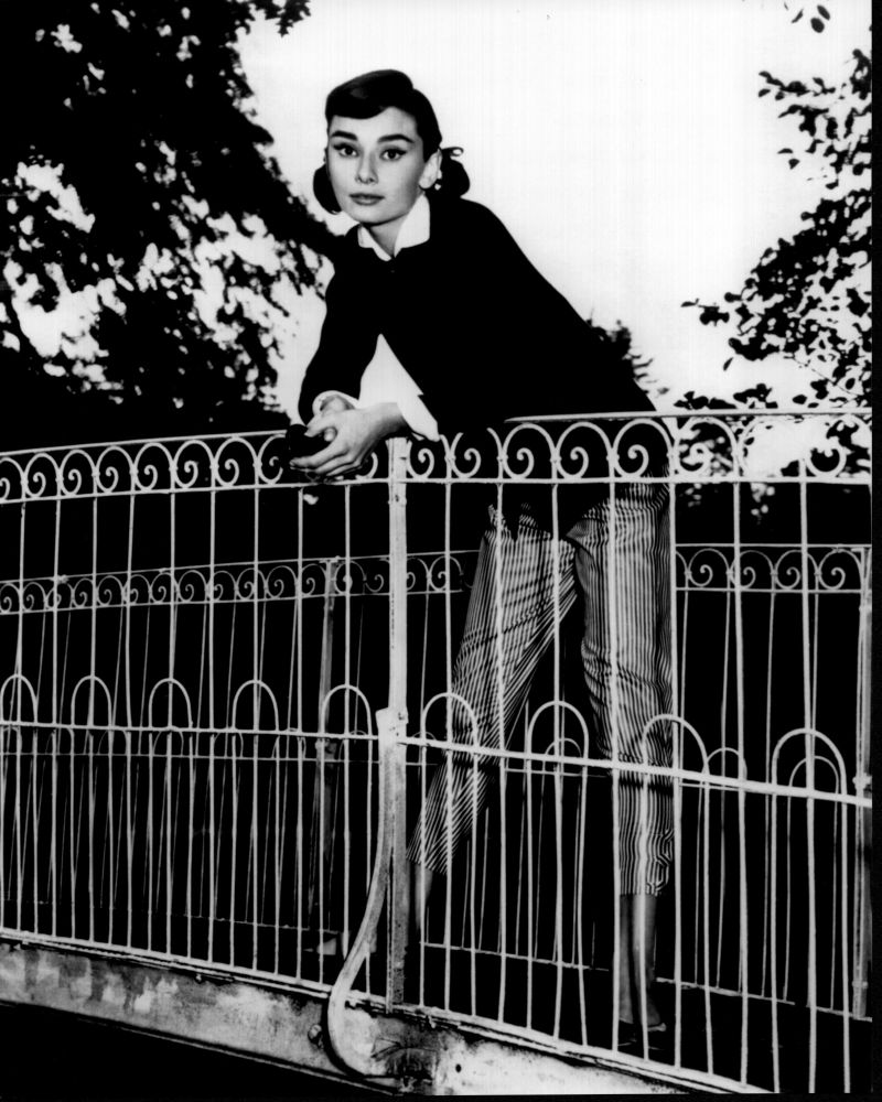 Audrey Hepburn leaning on bridge black and white photo print