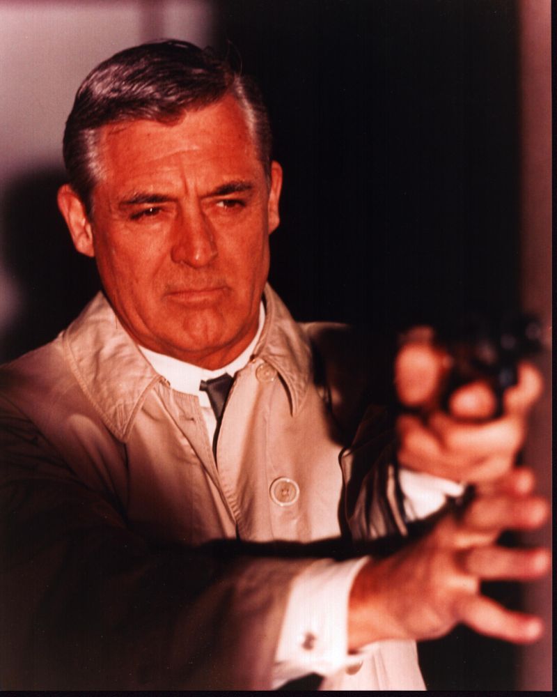 Cary Grant aiming gun in Charade photo print, vintage movie decor.