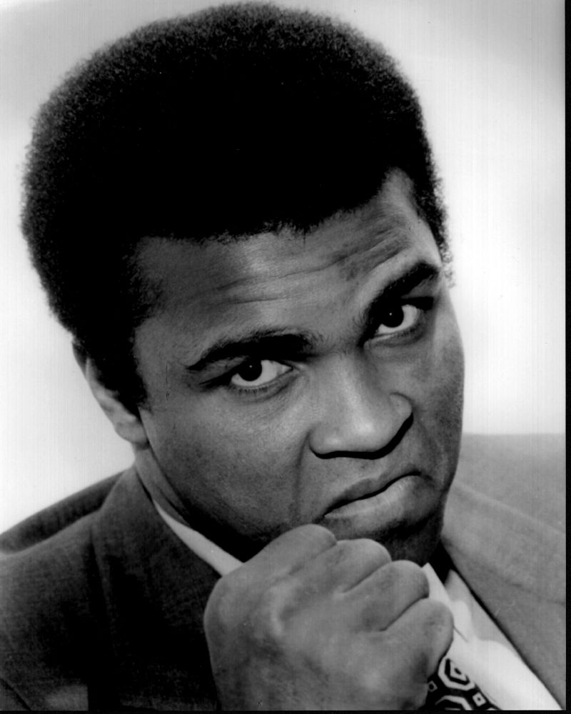 Muhammad Ali black and white photo print with fist up in suit.