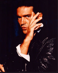 Antonio Banderas photo print in leather jacket, hand on face