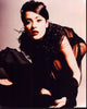 Salma Hayek in black sheer outfit with feathers photo print