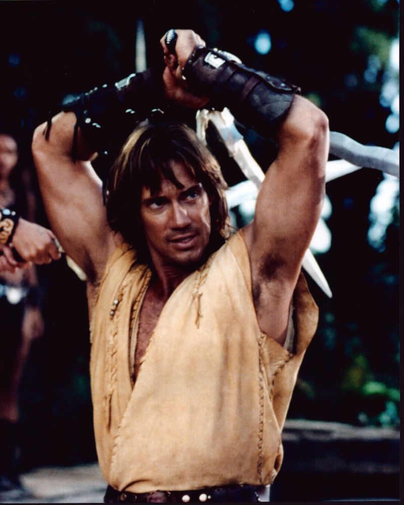 Kevin Sorbo Hercules Photo Print holding sword above head.