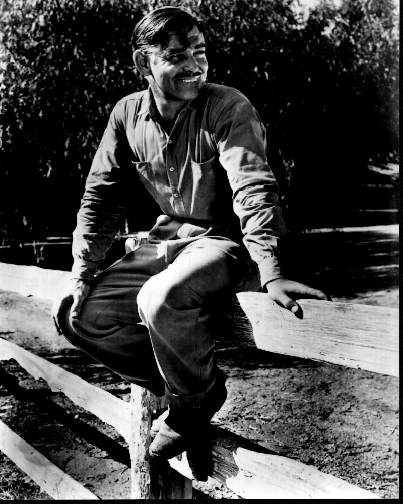 Clark Gable sitting on a fence in It Happened One Night black and white photo print.
