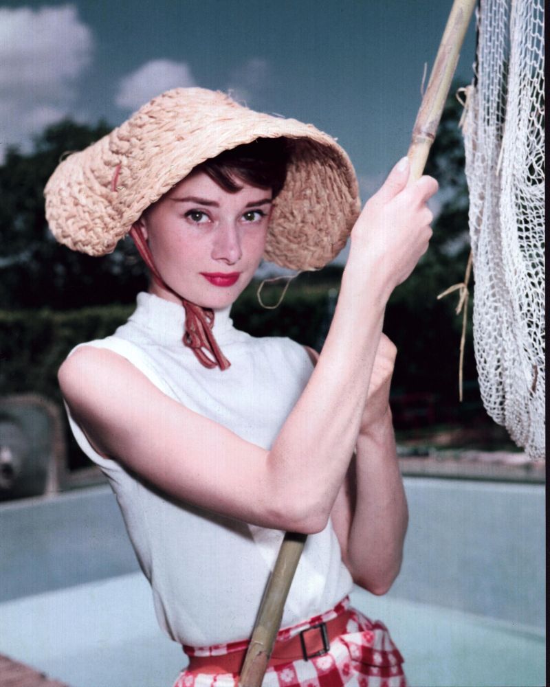 Audrey Hepburn in Straw Hat Photo Print, showcasing her timeless elegance.
