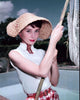 Audrey Hepburn in Straw Hat Photo Print, showcasing her timeless elegance.