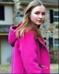Olivia Dejonge wearing a pink coat from The Visit photo print