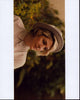 Laura Zak wearing a hat photo print showcasing vibrant colors and intricate details.