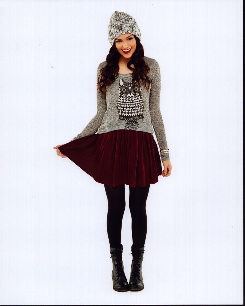 Bethany Mota in a stylish red skirt and gray sweater photo print.
