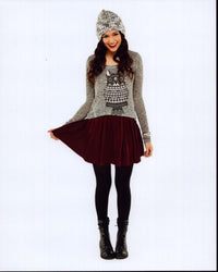 Bethany Mota in a stylish red skirt and gray sweater photo print.