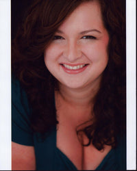 Dierdre Friel smiling headshot photo print in a blue top.