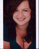 Dierdre Friel smiling headshot photo print in a blue top.