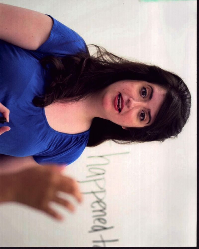 Cate Freedman wearing a blue top in a teachers photo print.