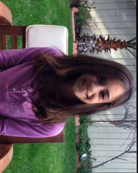 Soni Bringas sitting in a purple top - vibrant photo print