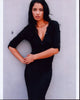 Jessica Clark leaning on wall in black top photo print.
