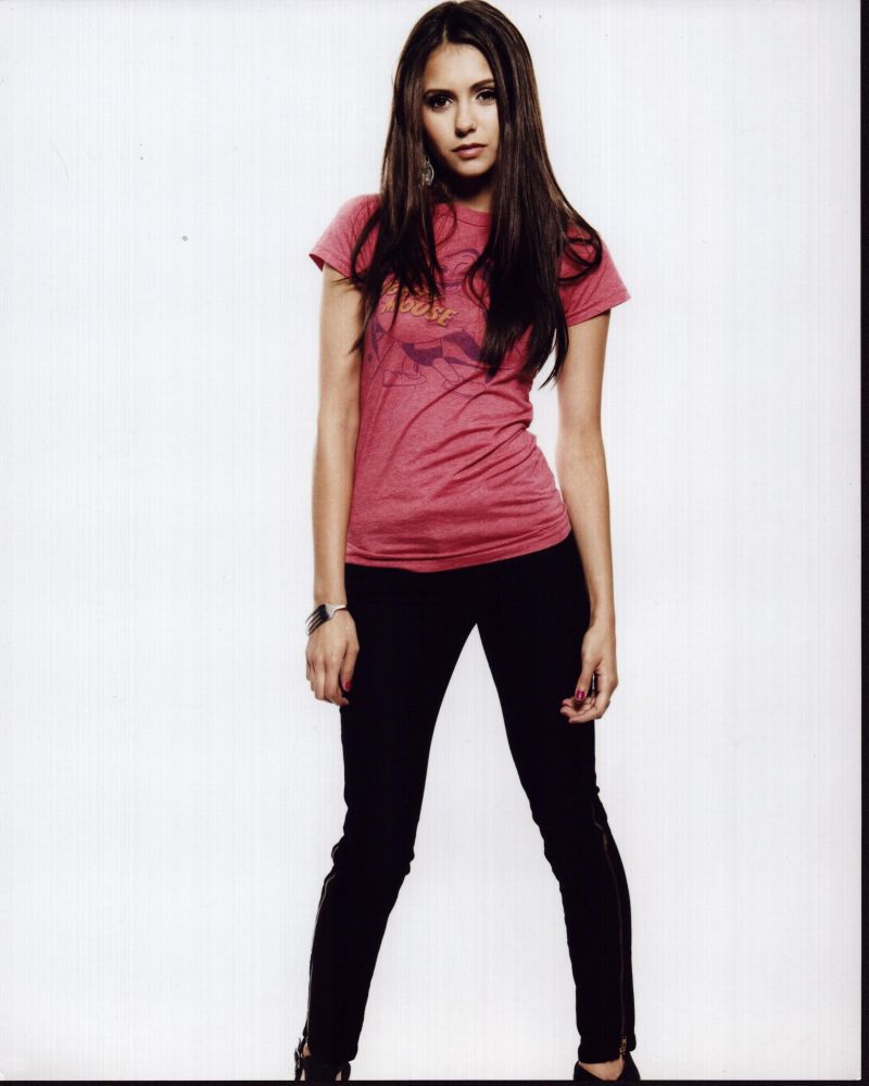 Nina Dobrev photo print in pink shirt and black pants