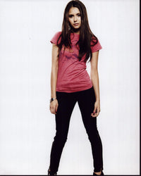 Nina Dobrev photo print in pink shirt and black pants