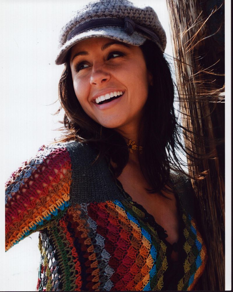 Nikki Boyer in multicolored sweater photo print.