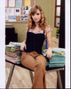 Britt Irvin Sitting On Desk Photo Print showcasing a charming moment.