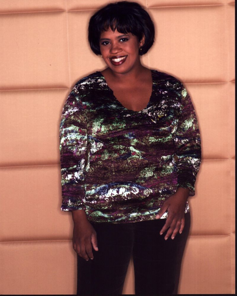 Chandra Wilson photo print featuring her in a vibrant multi-colored top