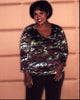 Chandra Wilson photo print featuring her in a vibrant multi-colored top