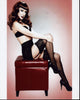 Kathy Griffin sitting with knee up photo print in pin-up style.