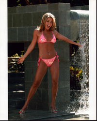 Courtney Friel next to a waterfall photo print