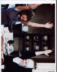 Laverne & Shirley scene photo print featuring hands up gesture.