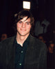 Photo print of Ashton Kutcher wearing a green blazer, stylish and elegant.
