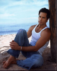 Shawn Christian sitting on the beach photo print showcasing a tranquil scene.