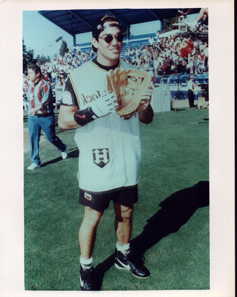 Dean Cain holding a baseball glove photo print.