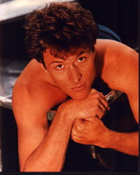 Tim Daly laying shirtless photo print, available in multiple sizes.