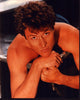 Tim Daly laying shirtless photo print, available in multiple sizes.