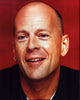 Bruce Willis close-up photo print in vibrant red background.