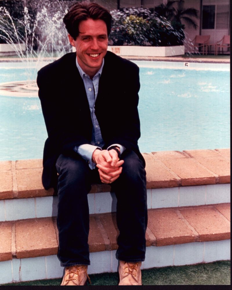 Hugh Grant Sitting Next To Fountain Photo Print