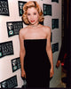 Photo print of Mira Sorvino in a strapless black dress with choker.