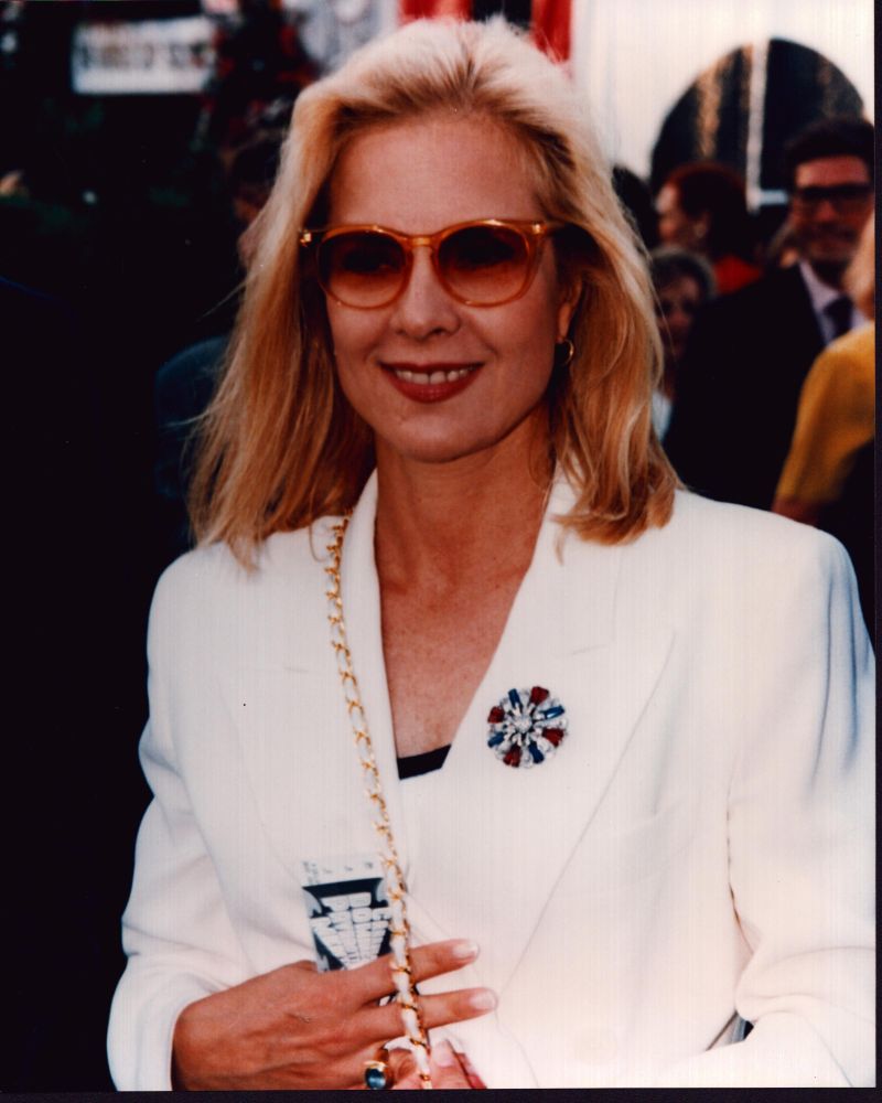 Photo print of Sylvie Vartan in a white suit and sunglasses