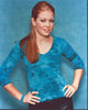 Melissa Joan Hart photo print in blue top with hands on hips.