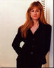 Holly Hunter photo print in black suit leaning on wall.