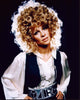 Julie Christie photo print in a black vest and silver necklaces.