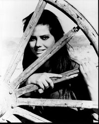 Claudia Cardinale Behind Wagon Wheel black and white photo print