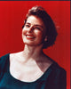 Ingrid Bergman smiling headshot photo print on red background.