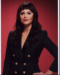 Sophia Amoruso photo print in blazer with hand on hip, stylish photography.