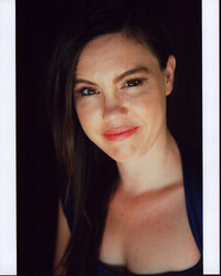 Celeste Cook headshot photo print in black top, available in multiple sizes.