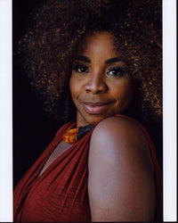 Kimberly Hebert Gregory headshot photo print in red sleeveless top.