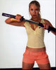Sarah Carter posing with sword from Doa: Dead Or Alive photo print.
