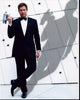 Michael Weatherly in Tuxedo holding a large silver gun photo print.